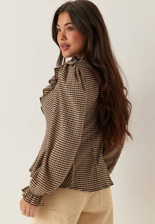 Jersey  Frill Peplum Blouse